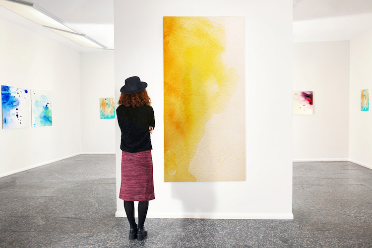 Woman admiring art in a gallery