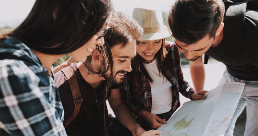 group of friends looking at a map
