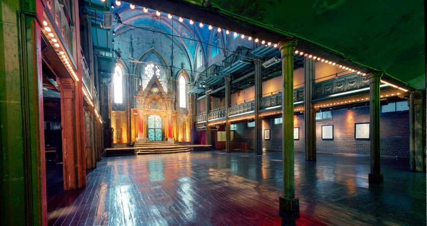 Inside of the Angel Orensanz Foundation illuminated by lights.