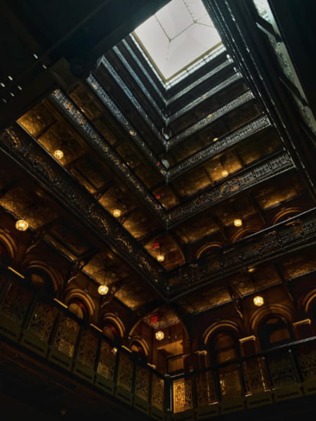 Inside of the Beekman Hotel with view of its skylight.