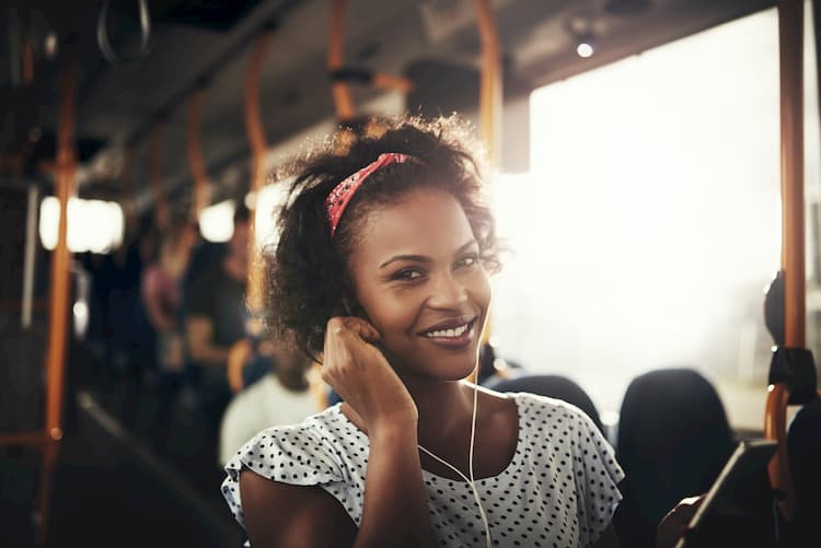 Woman listening to music on bus