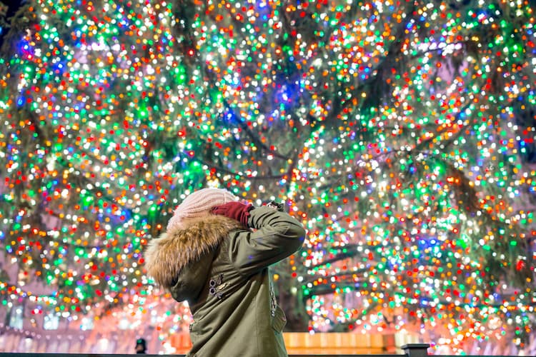 Girl with Rockefeller Christmas tree