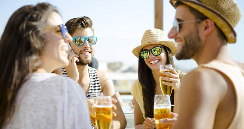 a group of friends at a brewery near the beach