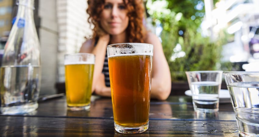 Close-up of a glass of beer on an outdoor table