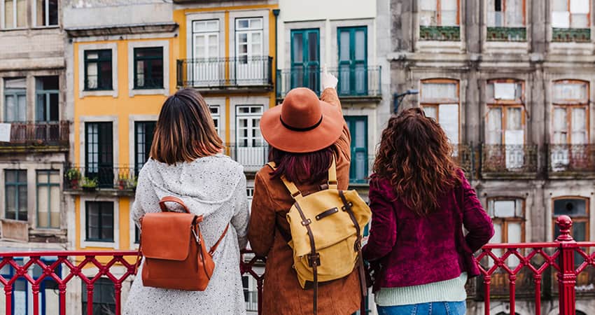 A group of women admire buildings in a city