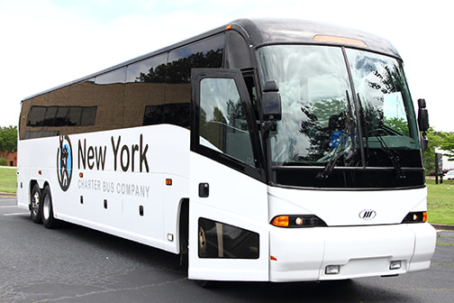 a plain white charter bus with a "New York Charter Bus Company" logo